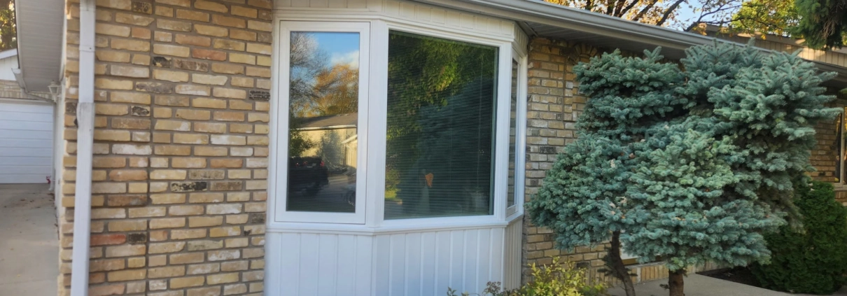 A replacement bay window custom-made and installed on a Winnipeg house by Hi-Tech.